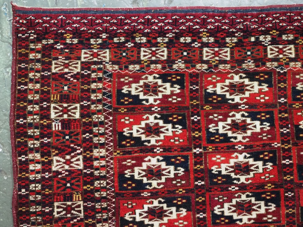 ANTIQUE TEKKE TURKMEN CHUVAL FACE OF SCARCE FORMAT WITH AINA GUL DESIGN, CIRCA 1880. View V
