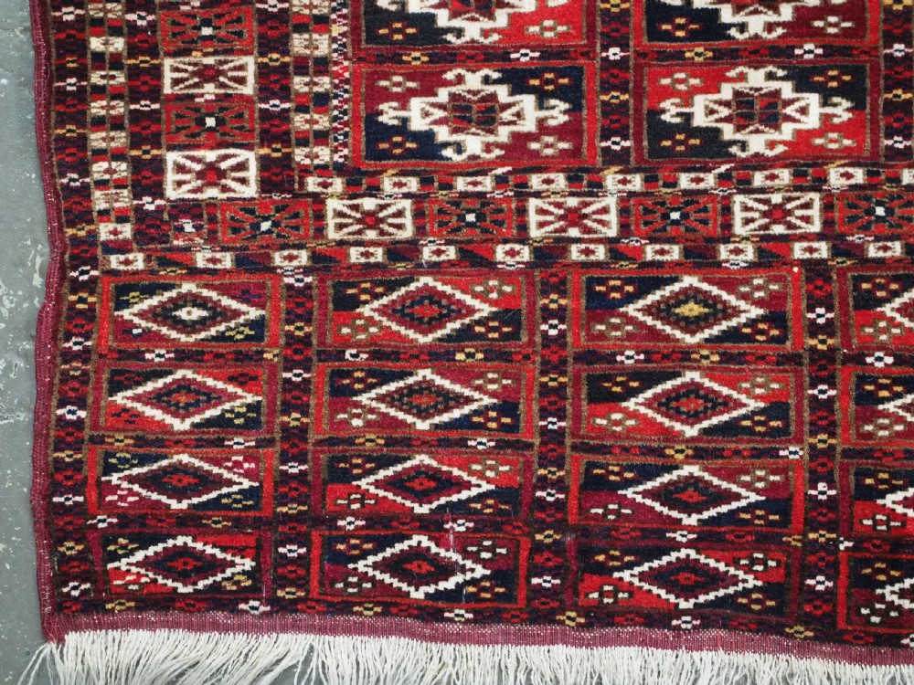 ANTIQUE TEKKE TURKMEN CHUVAL FACE OF SCARCE FORMAT WITH AINA GUL DESIGN, CIRCA 1880. View VI