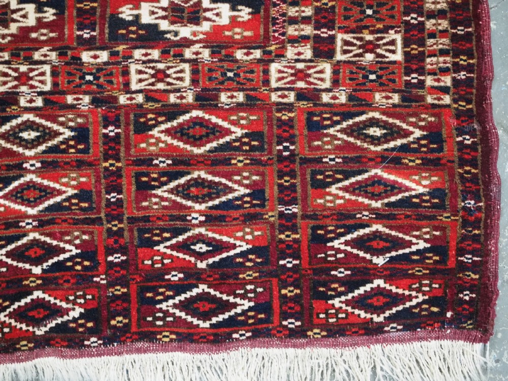 ANTIQUE TEKKE TURKMEN CHUVAL FACE OF SCARCE FORMAT WITH AINA GUL DESIGN, CIRCA 1880. View IX