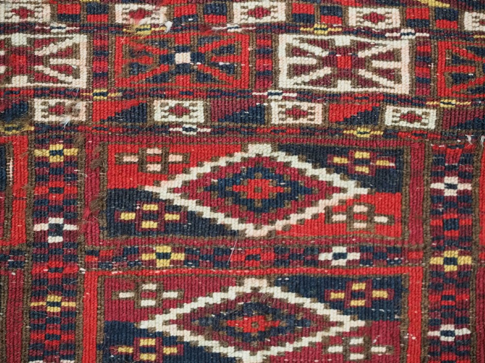 ANTIQUE TEKKE TURKMEN CHUVAL FACE OF SCARCE FORMAT WITH AINA GUL DESIGN, CIRCA 1880. View X