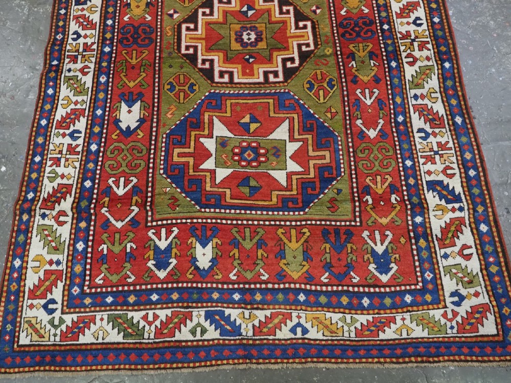 ANTIQUE CAUCASIAN KAZAK RUG WITH 'MEMLINC' GUL DESIGN, CIRCA 1880. View IV
