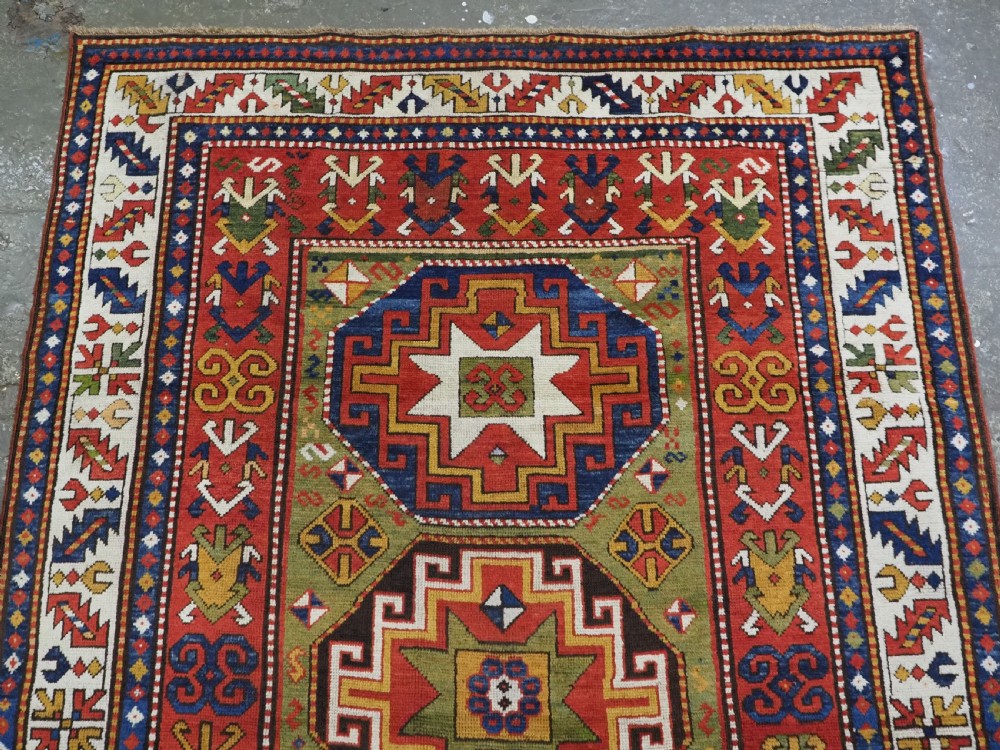 ANTIQUE CAUCASIAN KAZAK RUG WITH 'MEMLINC' GUL DESIGN, CIRCA 1880. View V