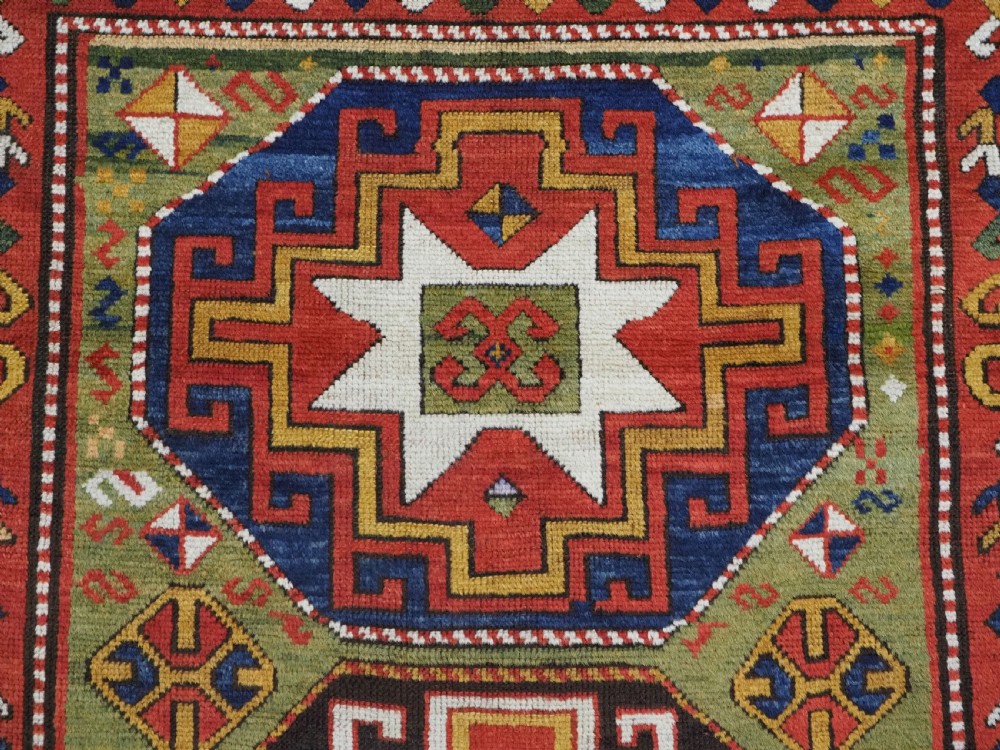 ANTIQUE CAUCASIAN KAZAK RUG WITH 'MEMLINC' GUL DESIGN, CIRCA 1880. View IX