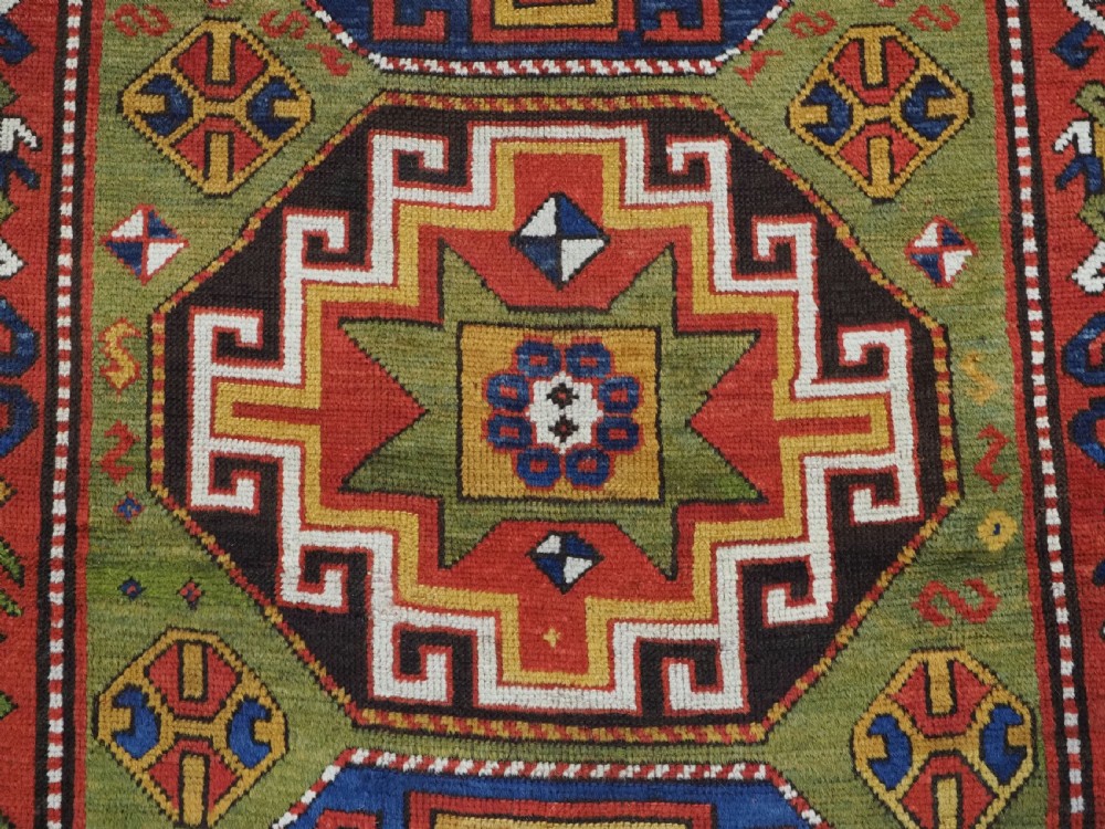 ANTIQUE CAUCASIAN KAZAK RUG WITH 'MEMLINC' GUL DESIGN, CIRCA 1880. View X