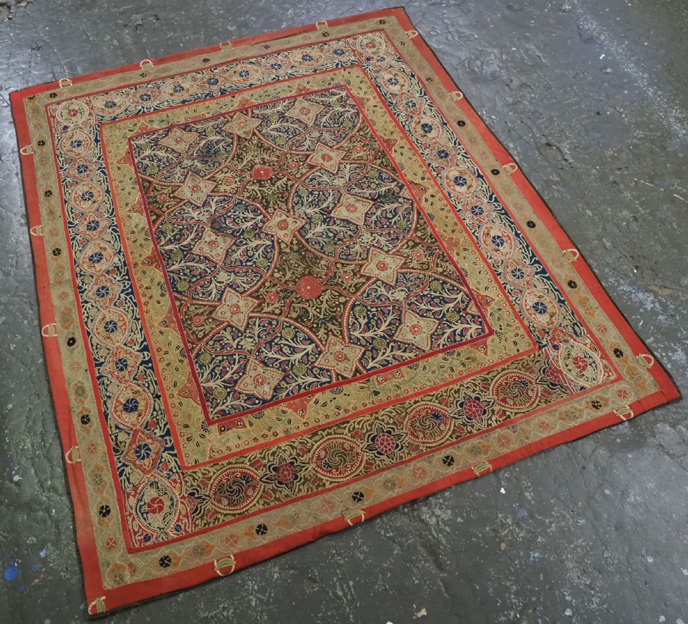 A rectangular 19th-century Persian Rasht textile featuring elaborate floral and geometric lattice patterns crafted from silk embroidery and felt applique in red, blue, green, and cream tones. View II