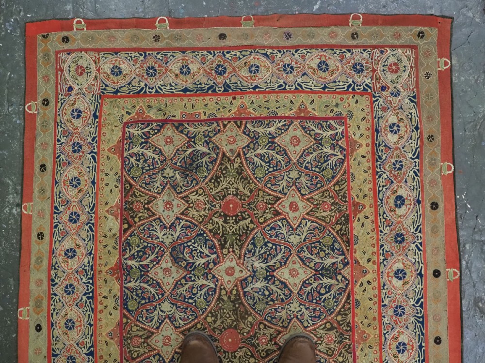 A rectangular 19th-century Persian Rasht textile featuring elaborate floral and geometric lattice patterns crafted from silk embroidery and felt applique in red, blue, green, and cream tones. View III