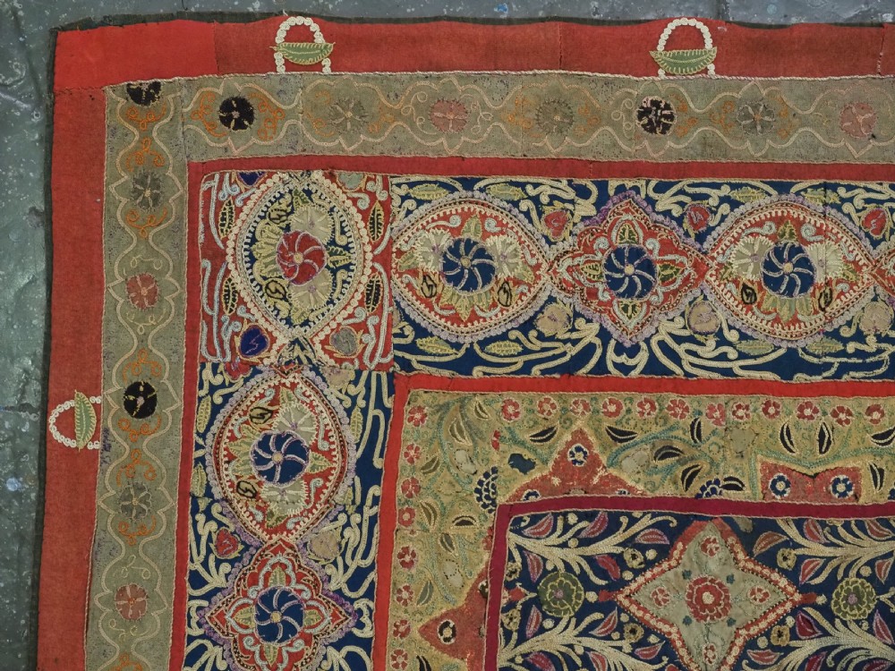 A rectangular 19th-century Persian Rasht textile featuring elaborate floral and geometric lattice patterns crafted from silk embroidery and felt applique in red, blue, green, and cream tones. View V
