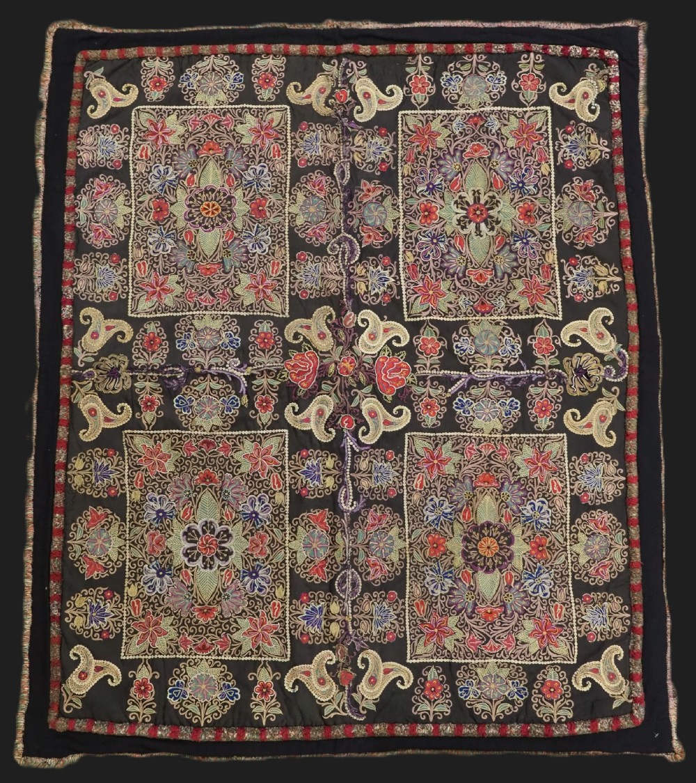 An antique Persian Rasht textile featuring silk floral and boteh embroidery on a black wool felt ground. View II