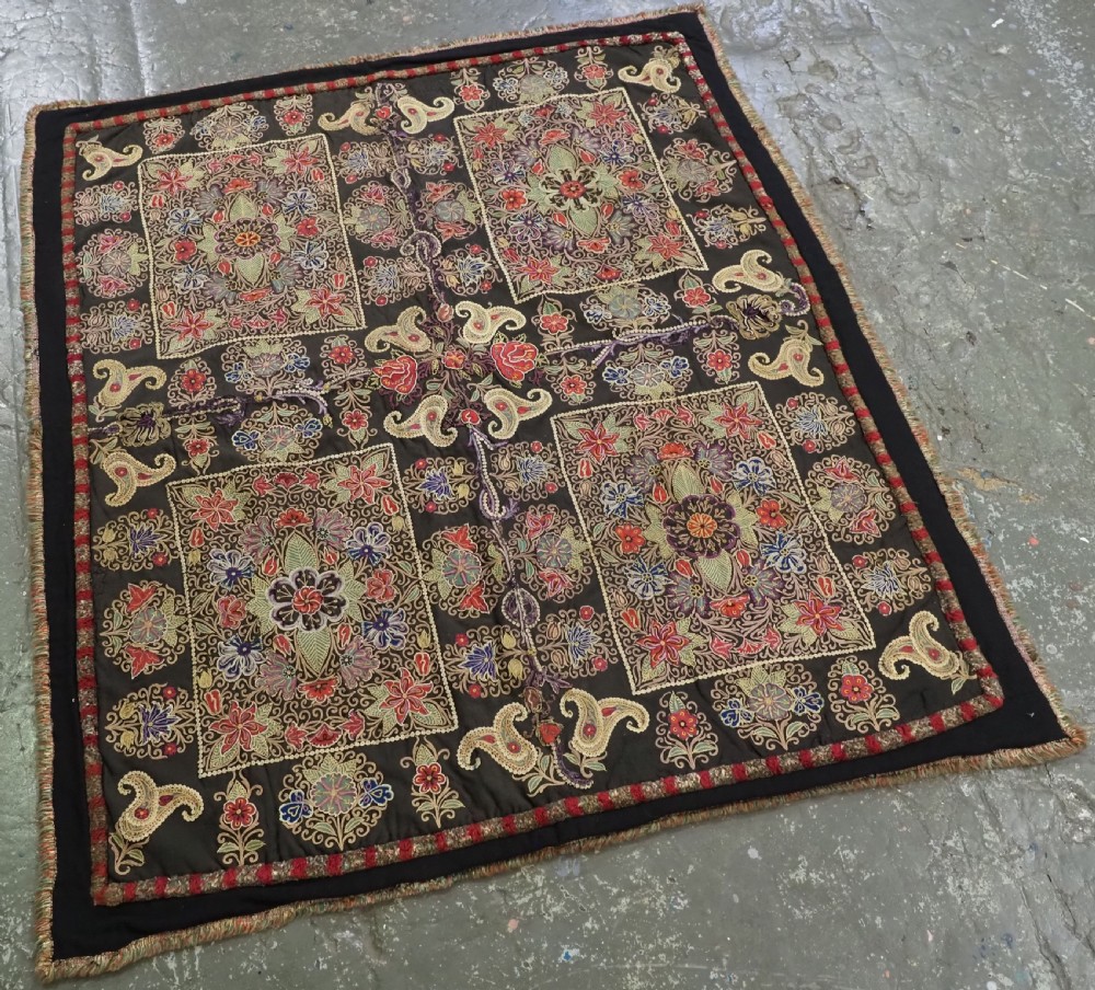 An antique Persian Rasht textile featuring silk floral and boteh embroidery on a black wool felt ground. View III