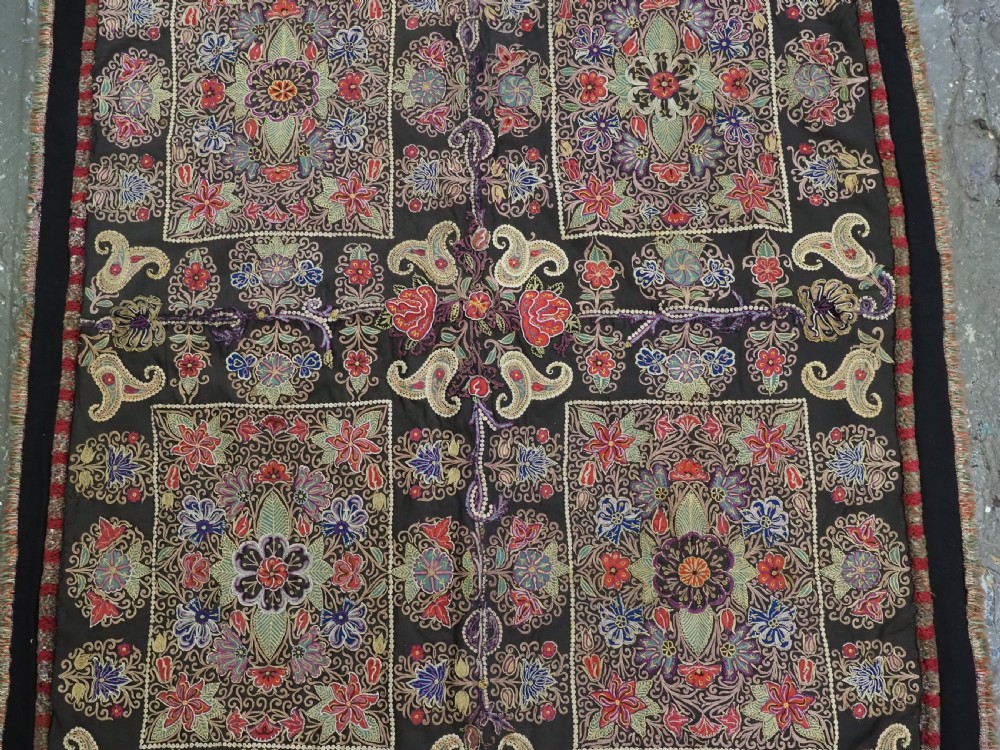 An antique Persian Rasht textile featuring silk floral and boteh embroidery on a black wool felt ground. View V