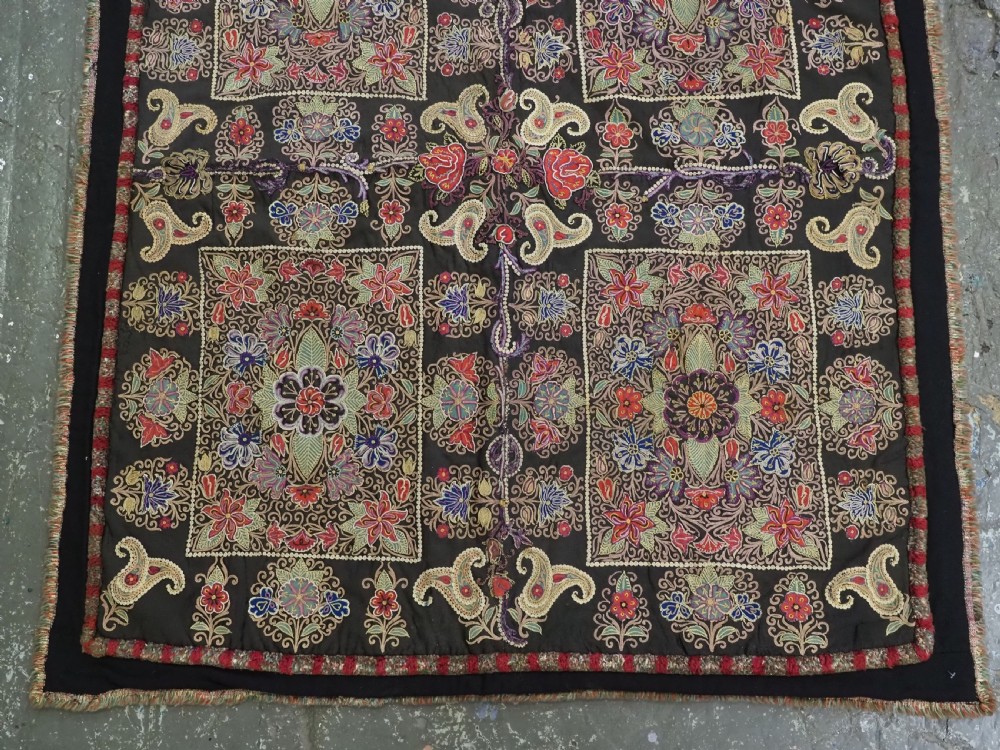 An antique Persian Rasht textile featuring silk floral and boteh embroidery on a black wool felt ground. View VI