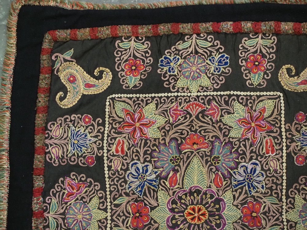 An antique Persian Rasht textile featuring silk floral and boteh embroidery on a black wool felt ground. View VII