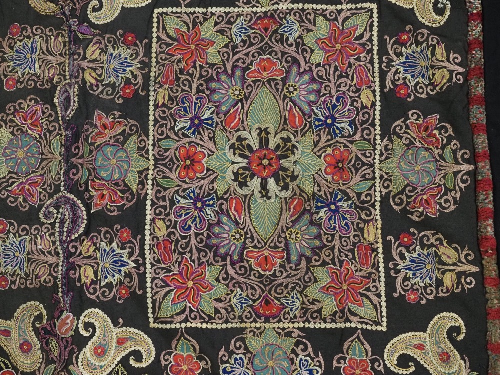 An antique Persian Rasht textile featuring silk floral and boteh embroidery on a black wool felt ground. View X