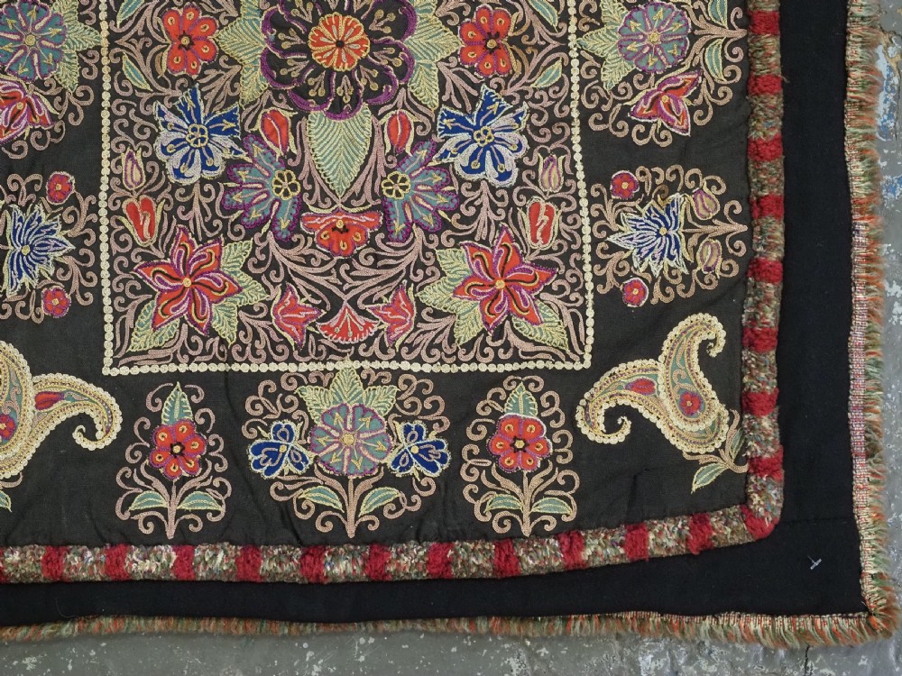 An antique Persian Rasht textile featuring silk floral and boteh embroidery on a black wool felt ground. View XIV