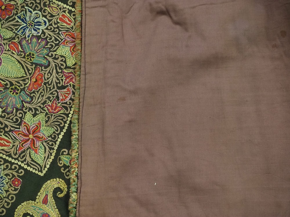 An antique Persian Rasht textile featuring silk floral and boteh embroidery on a black wool felt ground. View XV