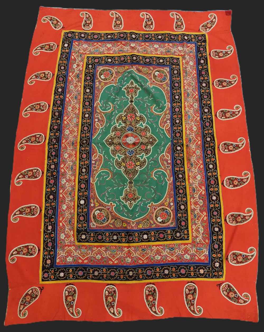 A rectangular antique Persian Rasht embroidery featuring a bright red outer border with boteh motifs surrounding a central green medallion with detailed silk stitching. View II