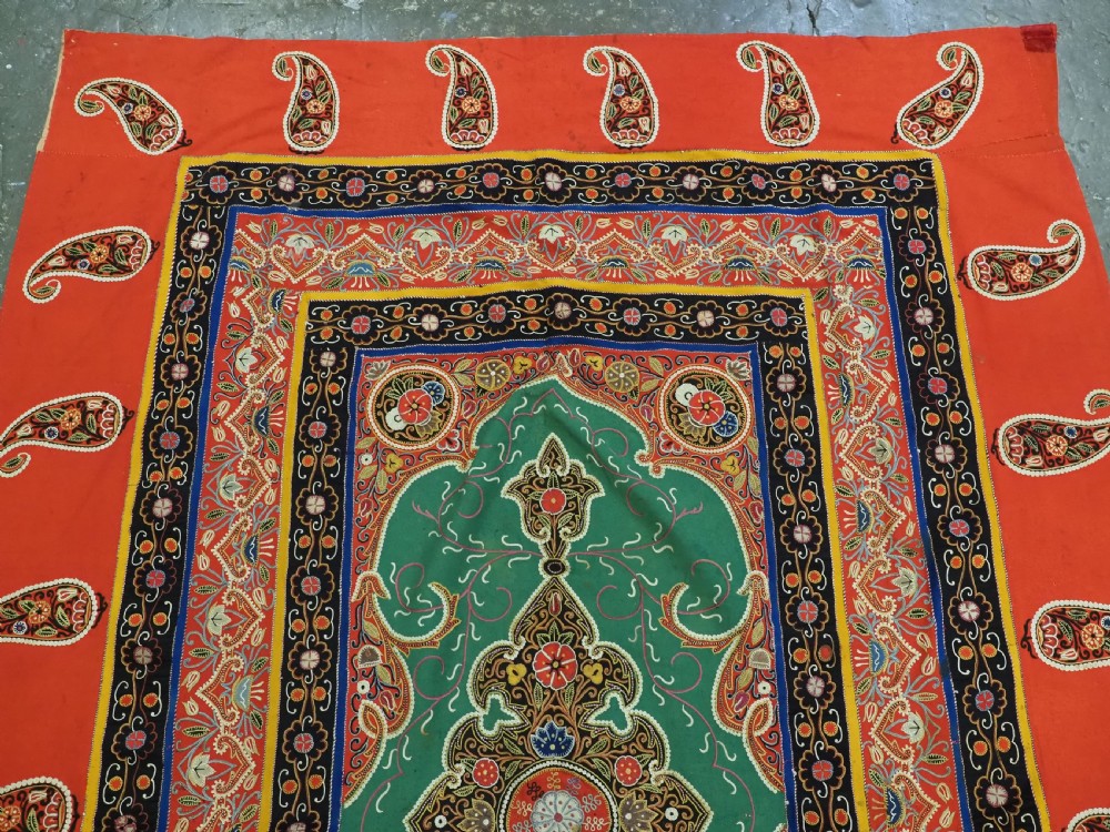 A rectangular antique Persian Rasht embroidery featuring a bright red outer border with boteh motifs surrounding a central green medallion with detailed silk stitching. View III