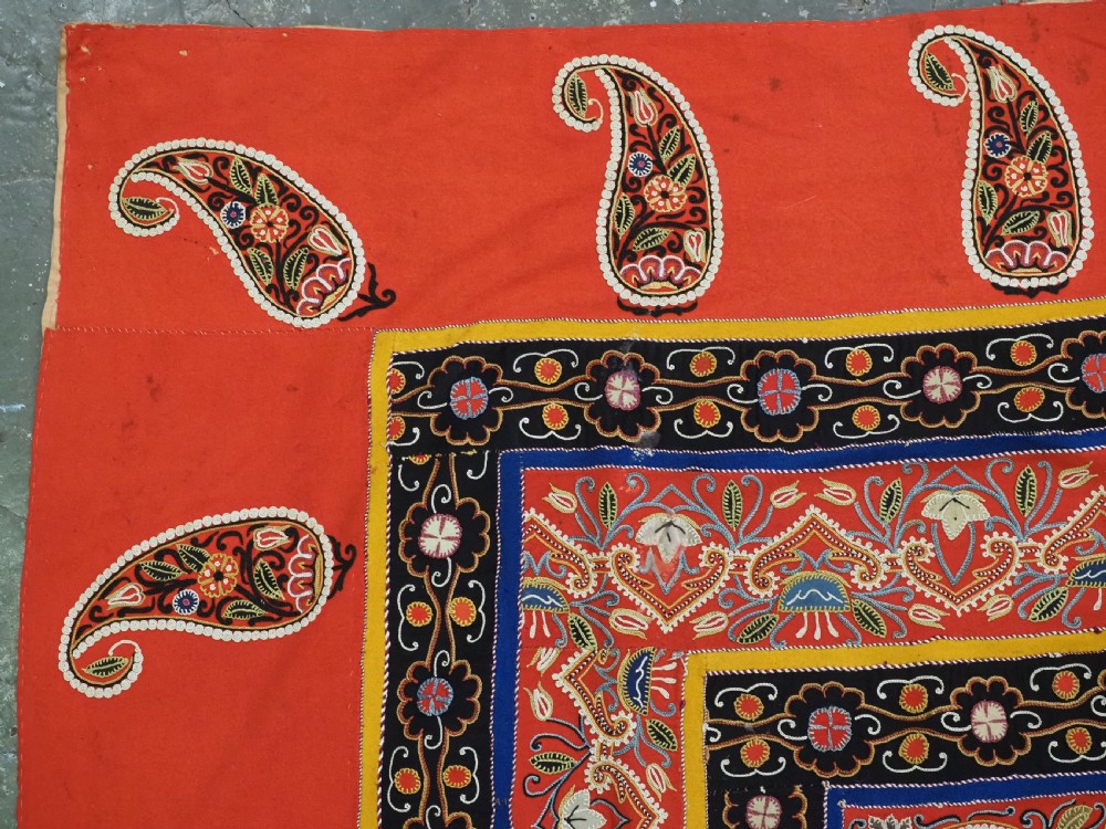 A rectangular antique Persian Rasht embroidery featuring a bright red outer border with boteh motifs surrounding a central green medallion with detailed silk stitching. View VII