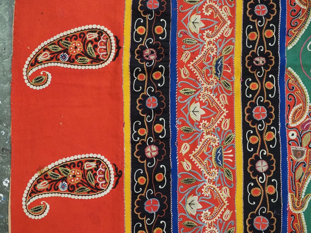 A rectangular antique Persian Rasht embroidery featuring a bright red outer border with boteh motifs surrounding a central green medallion with detailed silk stitching. View VIII
