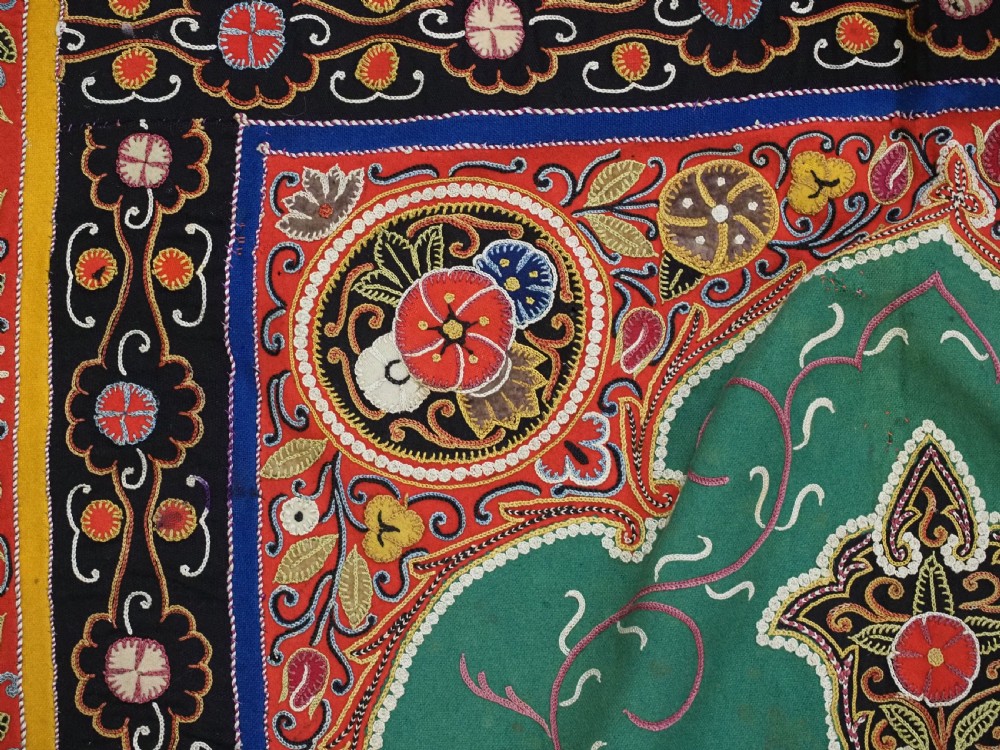 A rectangular antique Persian Rasht embroidery featuring a bright red outer border with boteh motifs surrounding a central green medallion with detailed silk stitching. View X