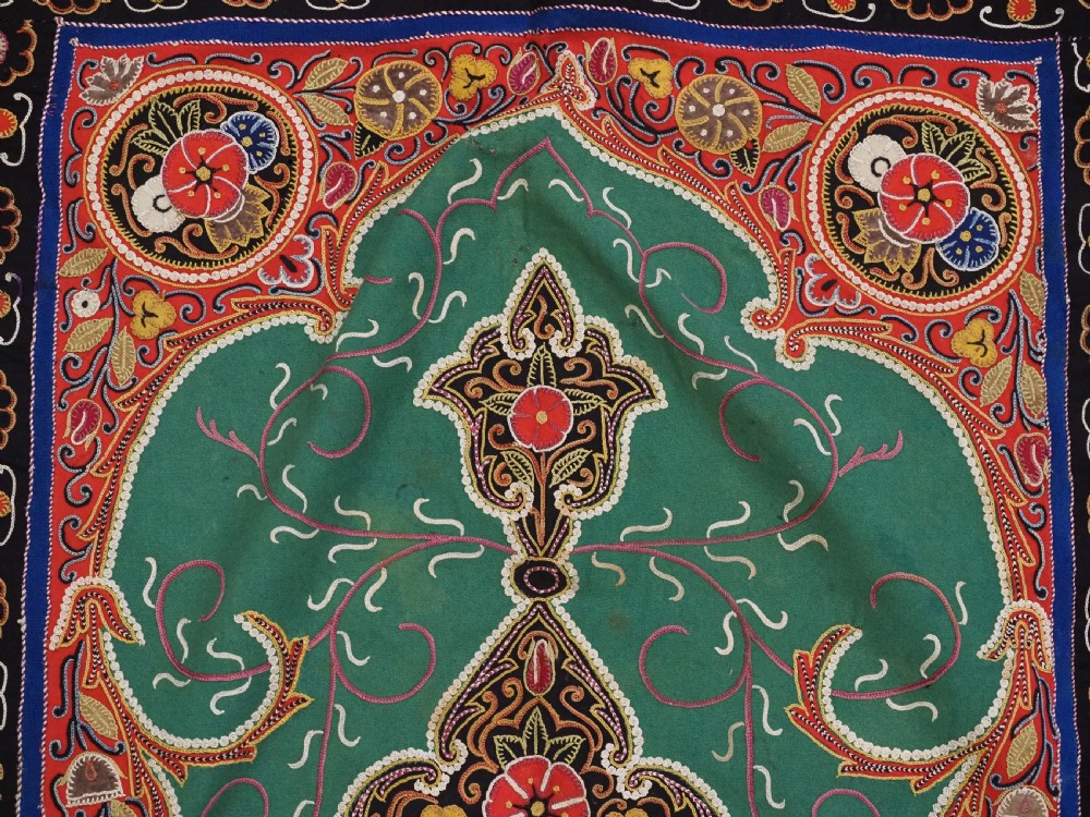 A rectangular antique Persian Rasht embroidery featuring a bright red outer border with boteh motifs surrounding a central green medallion with detailed silk stitching. View XI