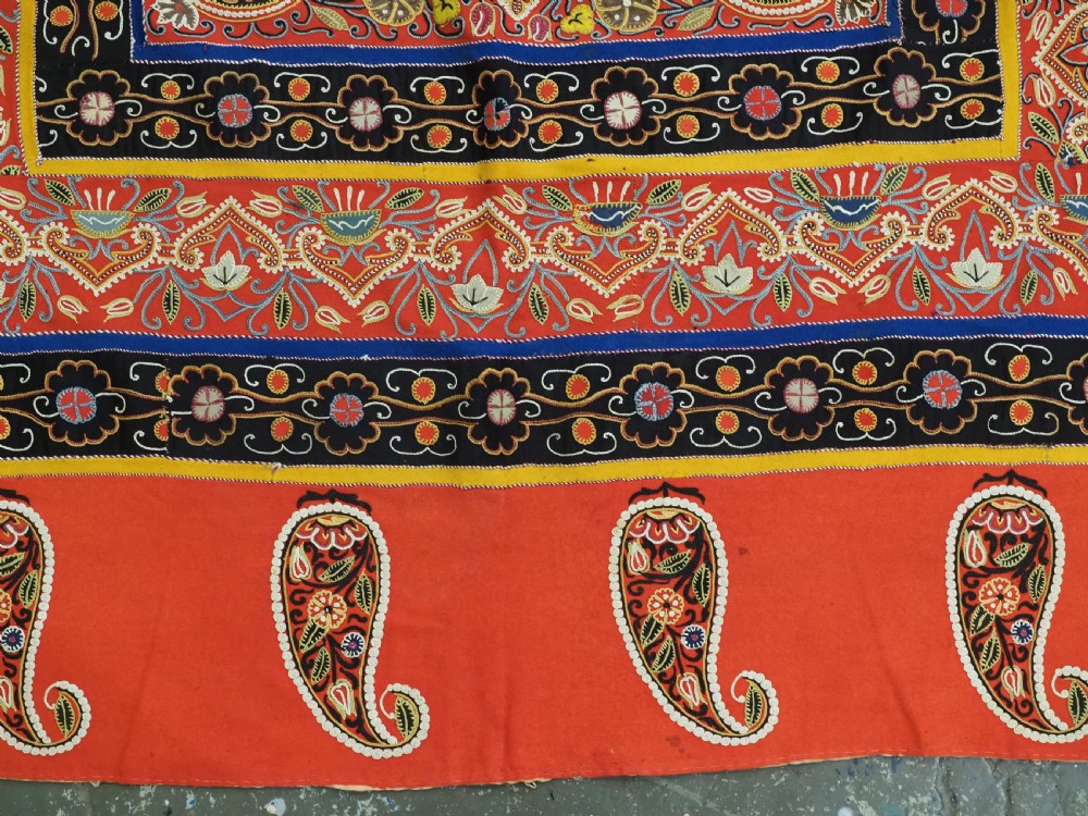 A rectangular antique Persian Rasht embroidery featuring a bright red outer border with boteh motifs surrounding a central green medallion with detailed silk stitching. View XV