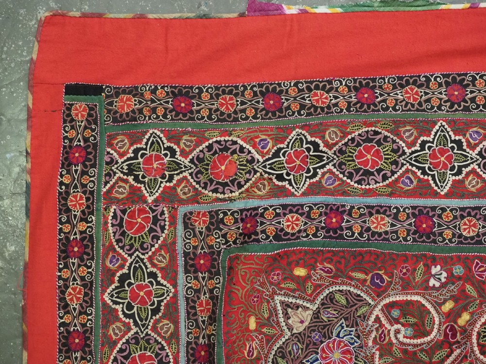 Square antique Persian Rasht embroidery featuring a central green and pink star medallion surrounded by floral motifs on red wool felt with decorative patterned borders. View V