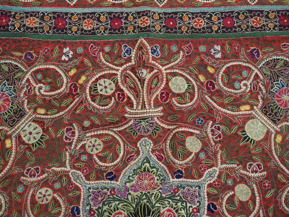 Square antique Persian Rasht embroidery featuring a central green and pink star medallion surrounded by floral motifs on red wool felt with decorative patterned borders. View IX