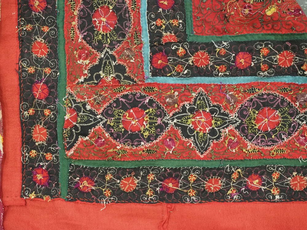 Square antique Persian Rasht embroidery featuring a central green and pink star medallion surrounded by floral motifs on red wool felt with decorative patterned borders. View XIV