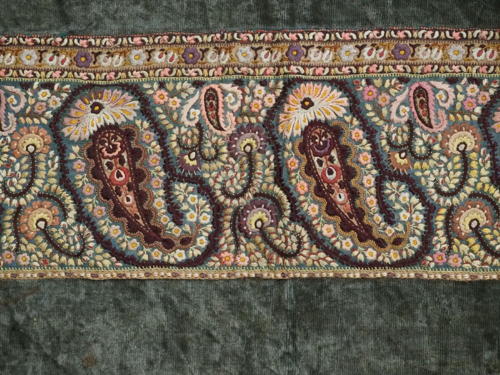 An antique rectangular olive green velvet textile decorated with intricate silk paisley embroidered borders and a fringed edge. View VII
