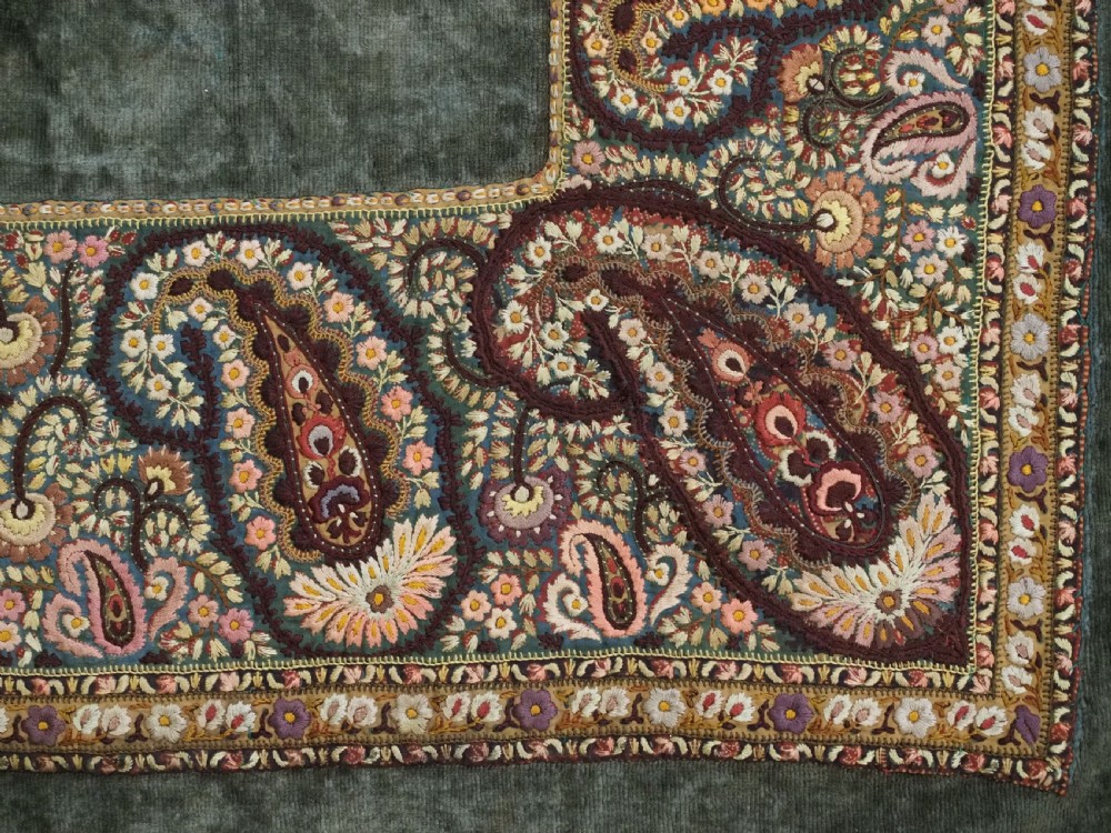 An antique rectangular olive green velvet textile decorated with intricate silk paisley embroidered borders and a fringed edge. View XI