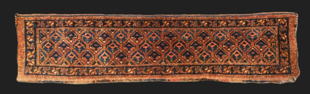 A horizontal antique Ersari Turkmen hand-knotted wool torba face featuring repeated geometric schemle gul motifs in dark blue and terracotta red tones.