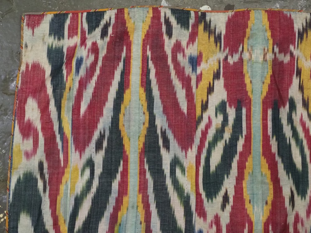 ANTIQUE UZBEK IKAT FABRIC PANEL, SEMI SILK ADRAS, BUKHARA, CIRCA 1900 OR EARLIER. View VI