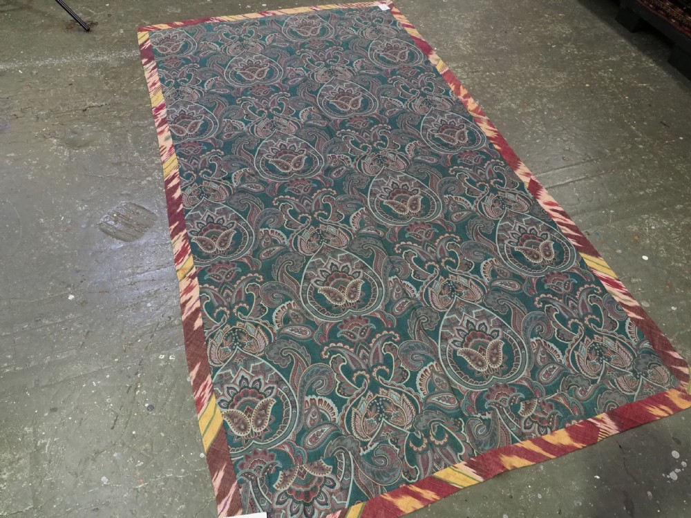 A vertical handwoven silk ikat textile panel featuring bold crimson, yellow, and deep purple circular geometric patterns on an off-white background. View XI