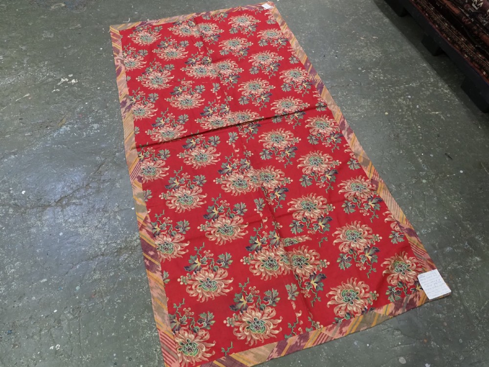 A rectangular handwoven Central Asian textile displaying vibrant geometric ikat motifs in crimson, yellow, and deep purple across three vertically stitched panels. View VIII