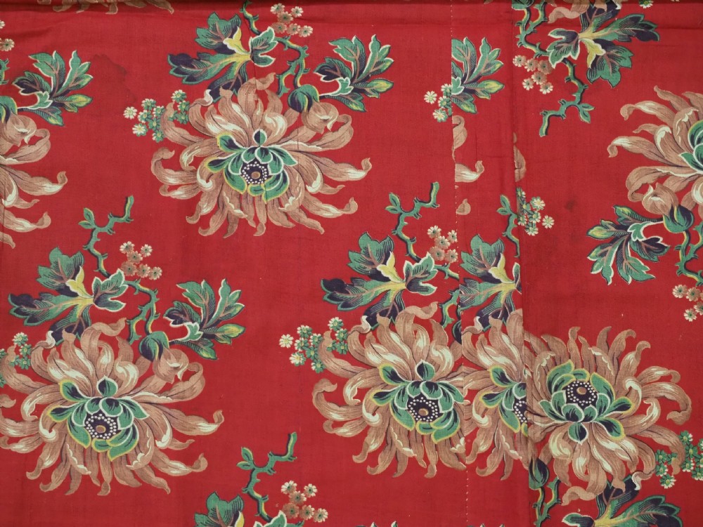 A rectangular handwoven Central Asian textile displaying vibrant geometric ikat motifs in crimson, yellow, and deep purple across three vertically stitched panels. View IX