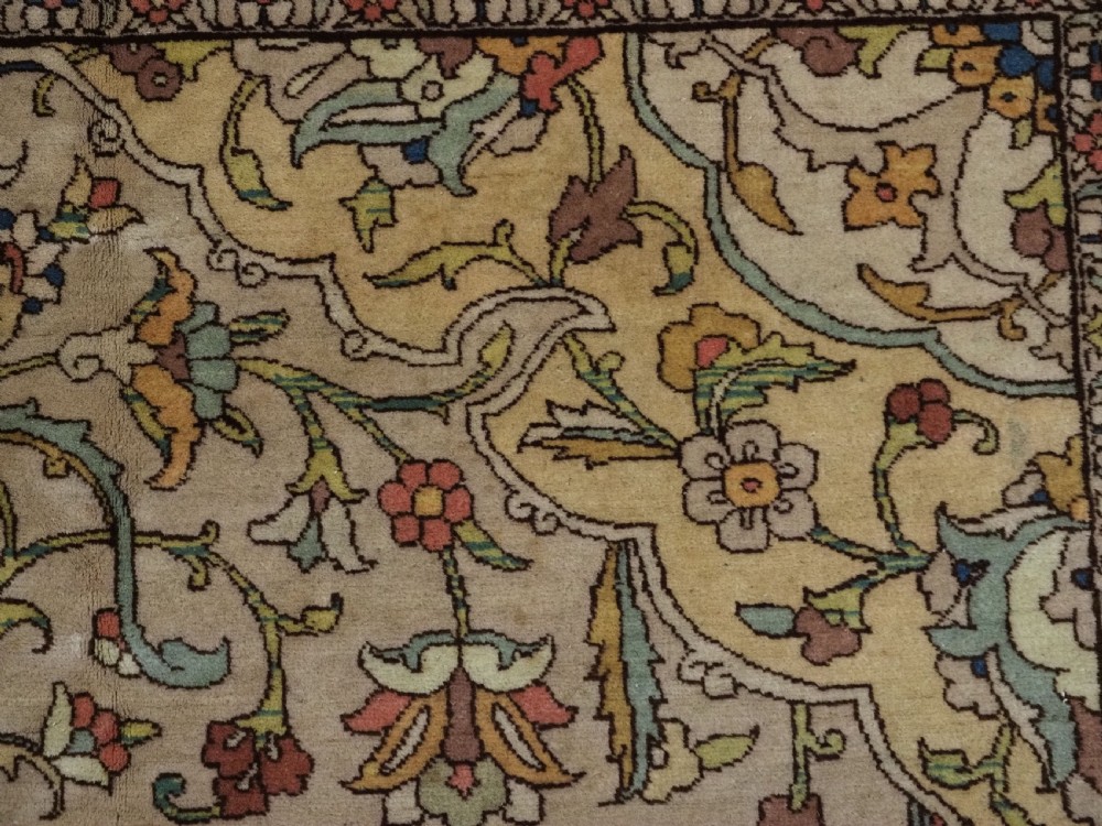 An antique hand-knotted Tabriz carpet featuring a central floral medallion, ornate spandrels, and a multi-tiered border in terracotta, cream, and soft pastel shades. View IX