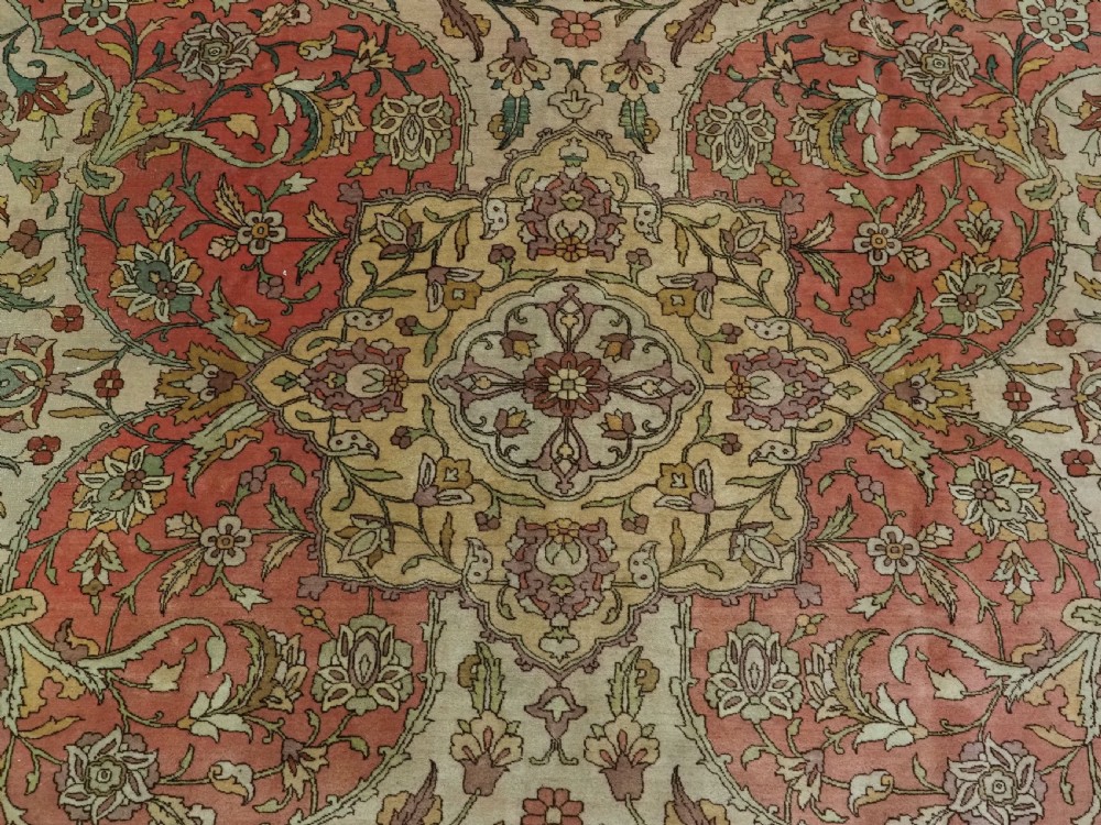 An antique hand-knotted Tabriz carpet featuring a central floral medallion, ornate spandrels, and a multi-tiered border in terracotta, cream, and soft pastel shades. View XI