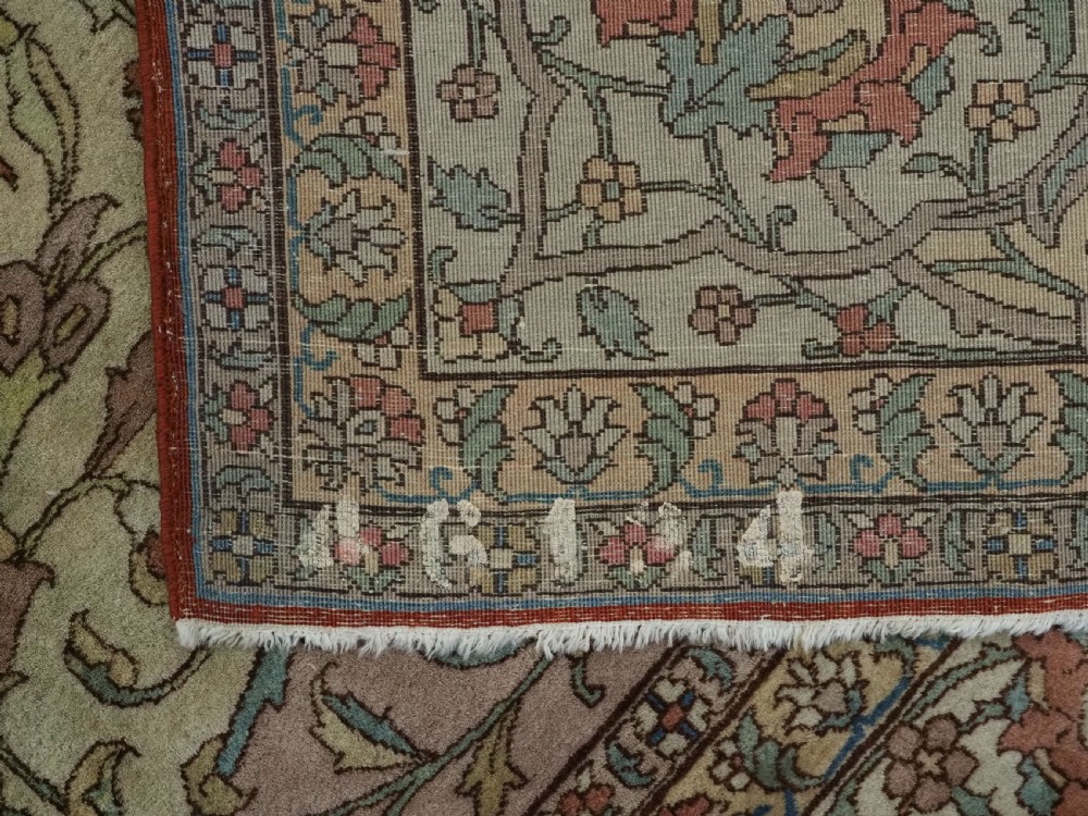 An antique hand-knotted Tabriz carpet featuring a central floral medallion, ornate spandrels, and a multi-tiered border in terracotta, cream, and soft pastel shades. View XVIII