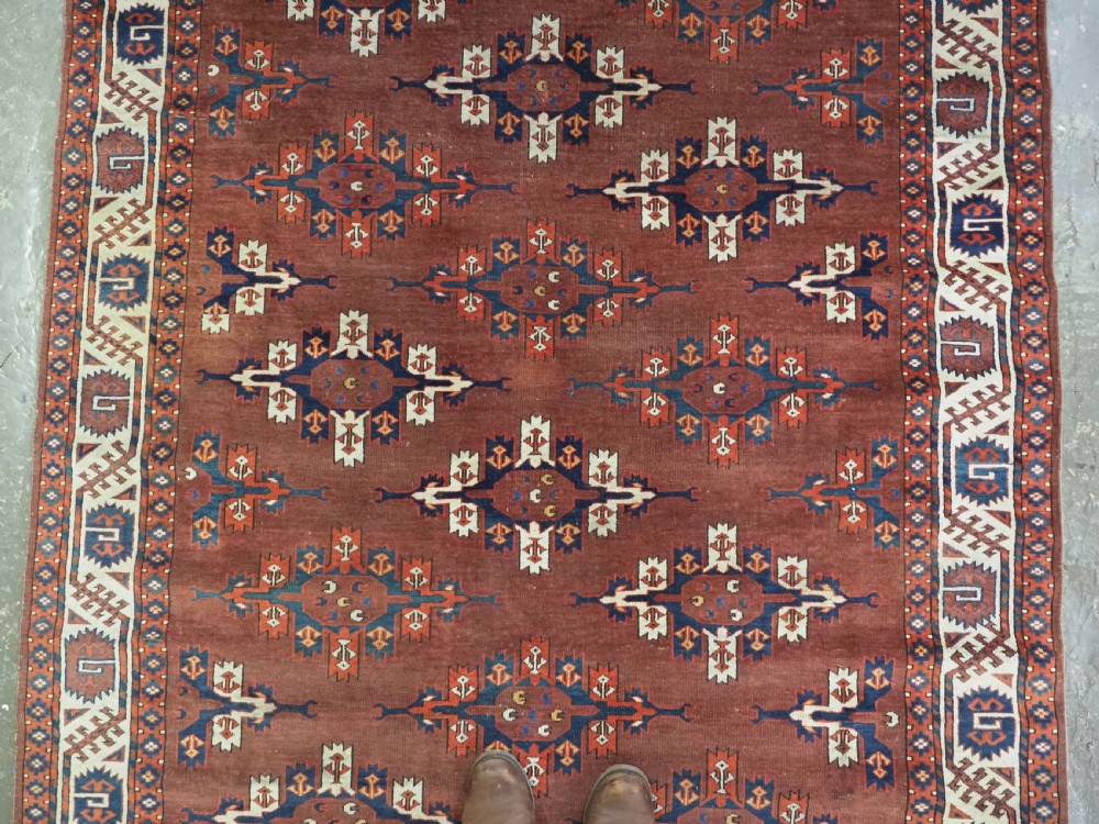 ANTIQUE KARADASAHLI YOMUT SMALL MAIN CARPET WITH C-CENTRED KEPSE GULS, EARLY 19TH CENTURY. View III