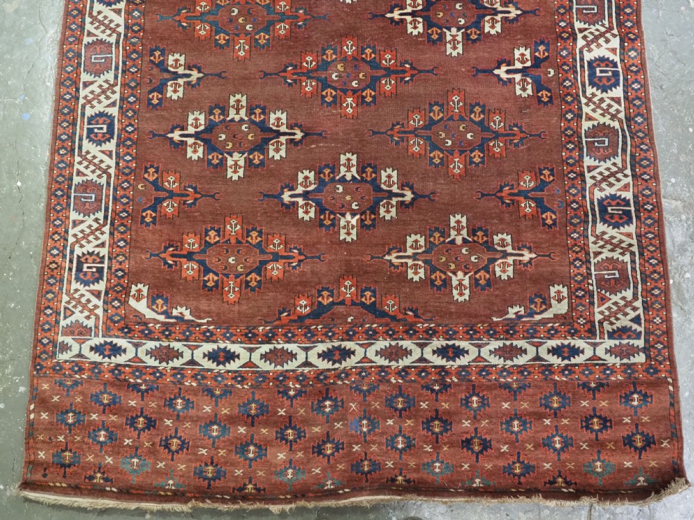 ANTIQUE KARADASAHLI YOMUT SMALL MAIN CARPET WITH C-CENTRED KEPSE GULS, EARLY 19TH CENTURY. View IV