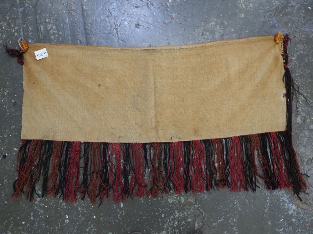 An elongated rectangular Turkmen Ersari torba featuring geometric diamond embroidery in red and dark tones with long fringed tassels along the bottom. View XIV