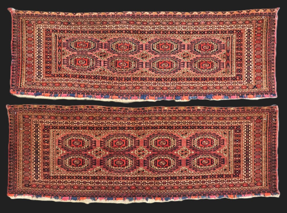 A pair of long rectangular hand-knotted dark red wool Tekke Turkmen torba bag faces featuring geometric octagonal Salor guls and detailed patterned borders.