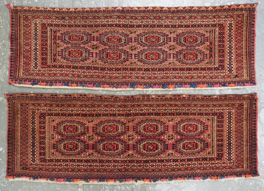 A pair of long rectangular hand-knotted dark red wool Tekke Turkmen torba bag faces featuring geometric octagonal Salor guls and detailed patterned borders. View II