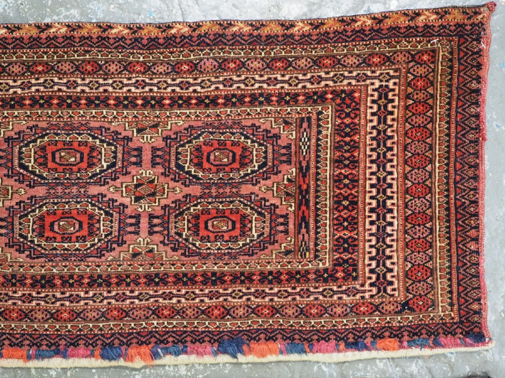 A pair of long rectangular hand-knotted dark red wool Tekke Turkmen torba bag faces featuring geometric octagonal Salor guls and detailed patterned borders. View VIII