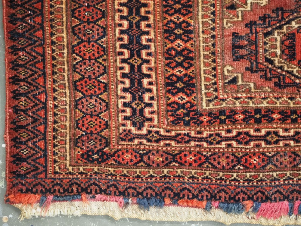 A pair of long rectangular hand-knotted dark red wool Tekke Turkmen torba bag faces featuring geometric octagonal Salor guls and detailed patterned borders. View X