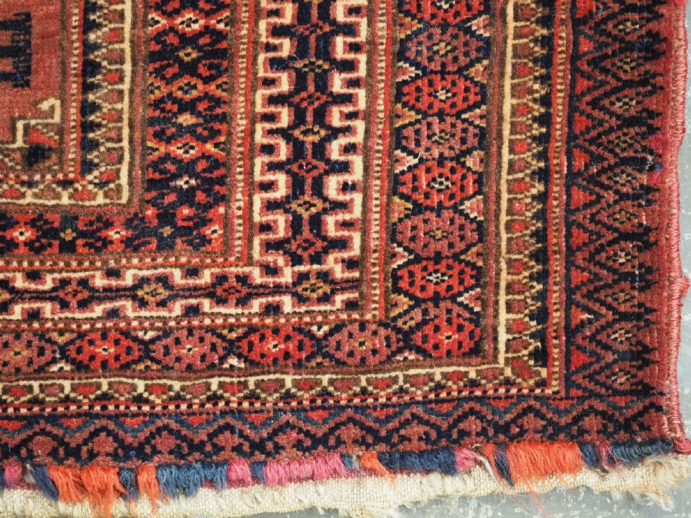 A pair of long rectangular hand-knotted dark red wool Tekke Turkmen torba bag faces featuring geometric octagonal Salor guls and detailed patterned borders. View XIV