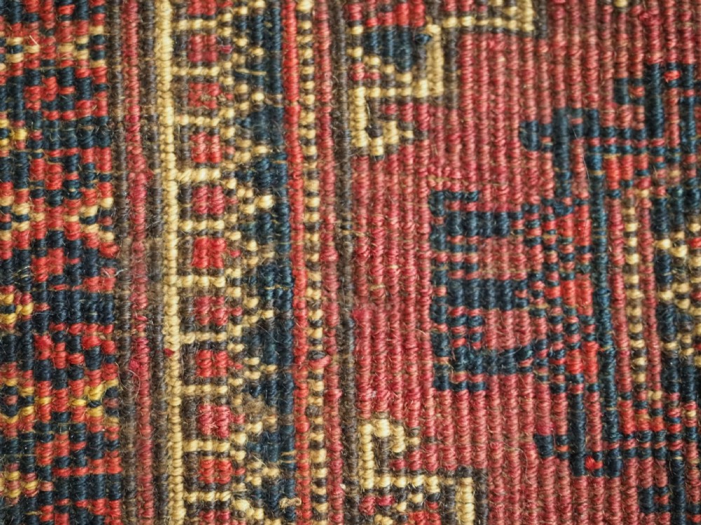 A pair of long rectangular hand-knotted dark red wool Tekke Turkmen torba bag faces featuring geometric octagonal Salor guls and detailed patterned borders. View XV