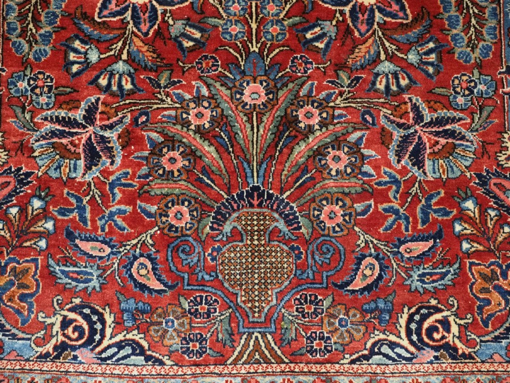 A hand-knotted wool Kashan prayer rug featuring a central floral medallion, a mihrab arch design, and intricate botanical borders in red, navy blue, and cream hues. View XIII