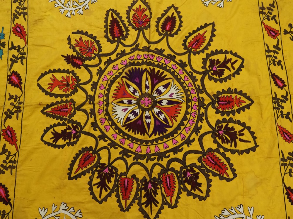 ANTIQUE UZBEK SUZANI, SILK EMBROIDERY ON A YELLOW COTTON GROUND, CIRCA 1900. View VIII